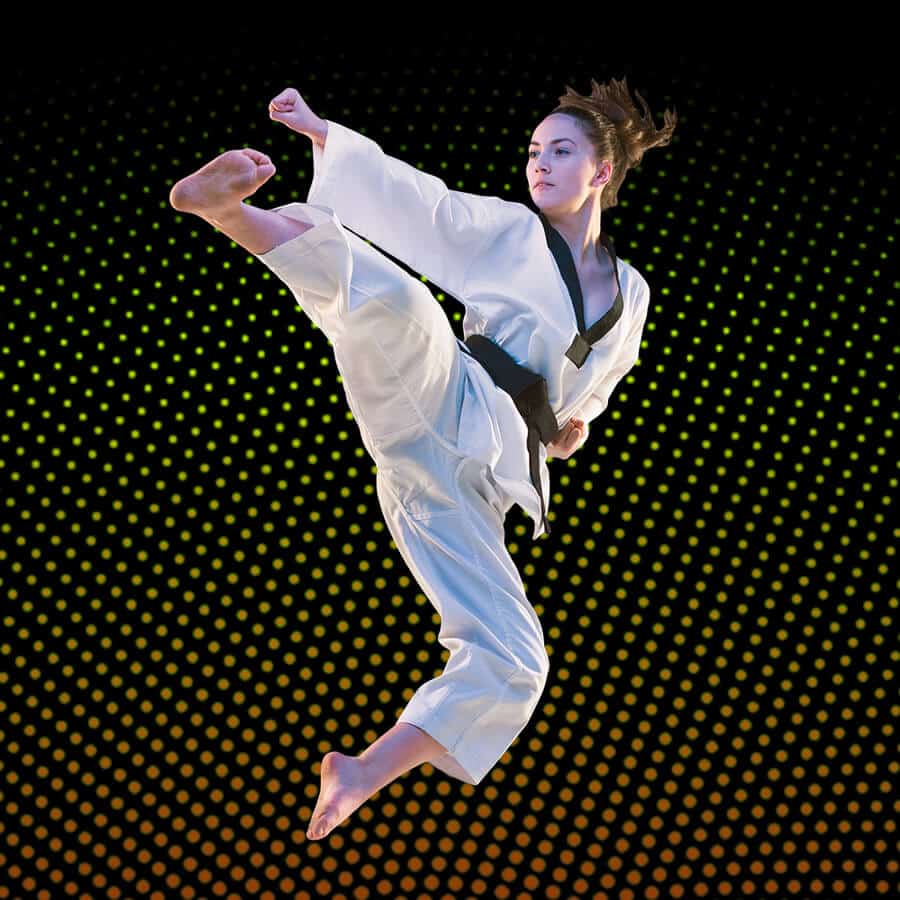 Martial Arts Lessons for Adults in Rockwall TX - Girl Black Belt Jumping High Kick
